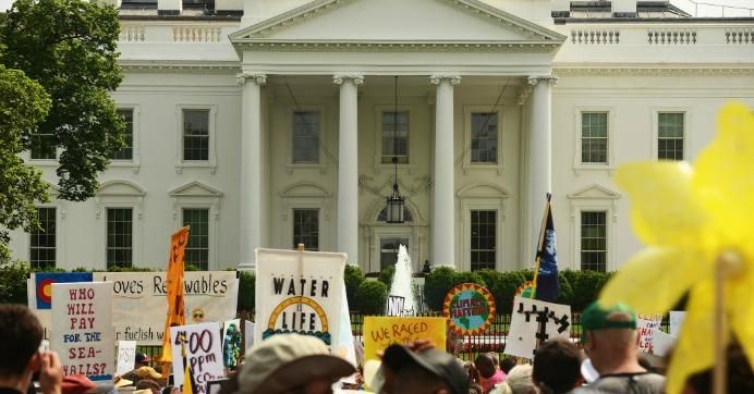 People march near the White House during the People's Climate Movement in Washington, D.C., April 29, 2017, to protest President Donald Trump's attack on the climate and the Environmental Protection Agency.
