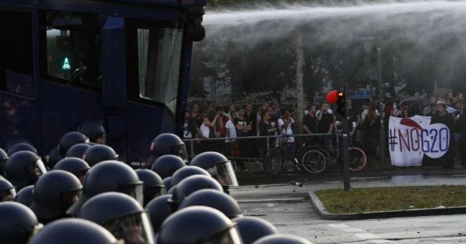 Riot police use water cannons during clashes with protesters against the G20 summit on July 7, 2017 in Hamburg, Germany.