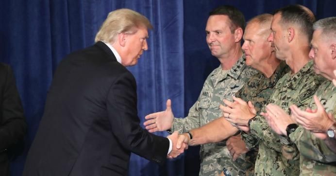 U.S. President Donald Trump greets military leaders before his speech on Afghanistan at the Fort Myer military base on August 21, 2017 in Arlington, Virginia.