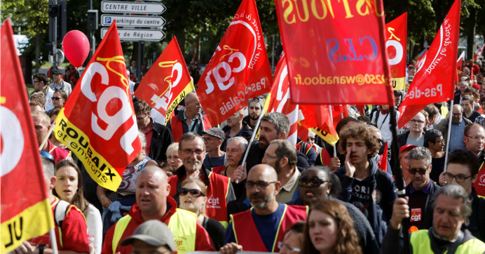 Demonstrators walk during a protest against the labour reform on September 12, 2017 in Paris, France.