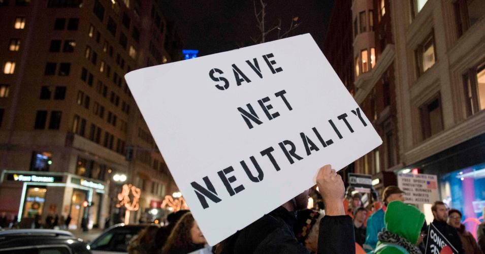 Protestors gather on Bolyston Street in front of a Verizon store during a net neutrality rally on December 7, 2017.