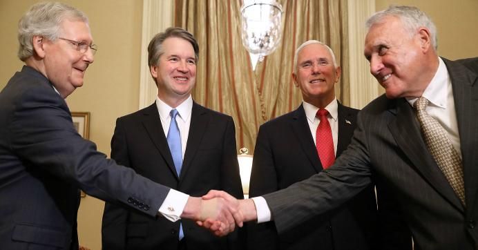 Senate Majority Leader Mitch McConnell (R-Ky.), U.S. Supreme Court nominee Brett Kavanaugh, Vice President Mike Pence, and former Sen. Jon Kyl (R-Ariz.) greet one another before a meeting in McConnell's office in the U.S. Capitol July 10, 2018. 