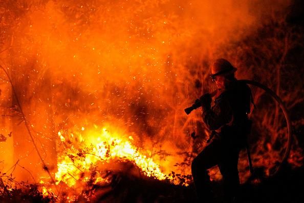 Firefighters perform structure protection against the Glass Fire in Napa County, California on Thursday, October 1, 2020. (Photo: Kent Nishimura/Los Angeles Times via Getty Images)