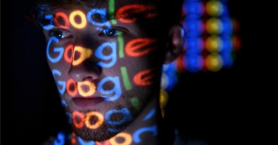 The Google logo is projected onto a man on August 09, 2017 in London.