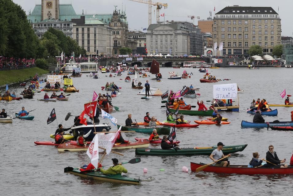 Protesters demonstrating against the upcoming G20 economic summit ride boats on Inner Alster lake during a protest march on July 2, 2017 in Hamburg, Germany.