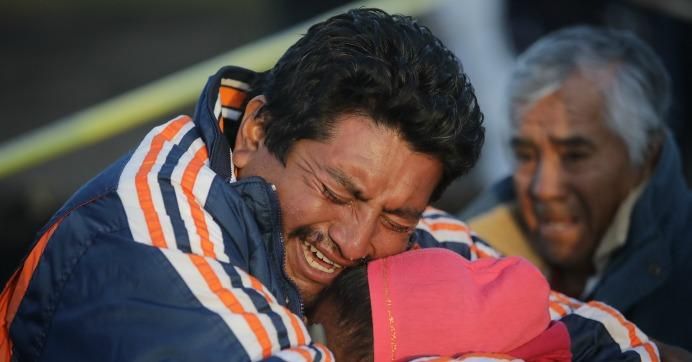 Family members of a victim cry when recognizing the body after an explosion in a pipeline belonging to Mexican oil company PEMEX on January 19, 2019 in Tlahuelilpan, Mexico.