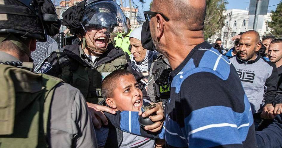 Israeli border police arresting Ahmad Abu Sbitan, 11, in front of his school in East Jerusalem. (Photo: Majd Gaith/HRW)