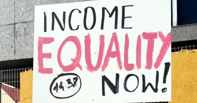 A sign held up during Monday's rally for wage parity in Reykjavík, Iceland.