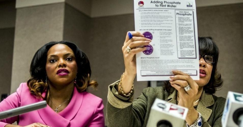 Flint Mayor Karen Weaver, right, and City Administrator Natasha Henderson, address questions about adding supplemental phosphates to the city’s water during a news conference in December. (Jake May/Flint Journal-MLive.com via AP)