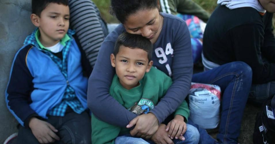 A woman from Honduras holds her child after turning herself in to U.S. Border Patrol agents on Dec. 8 near Rio Grande City, Texas. (Photo: John Moore/Getty Images)