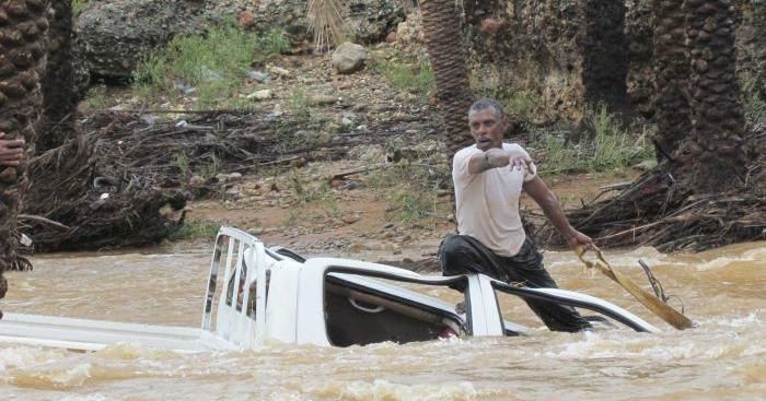  A man attempts to save a vehicle swept away by flood waters in Yemen's island of Socotra November 2, 2015. (Photo: Stringer/Reuters)