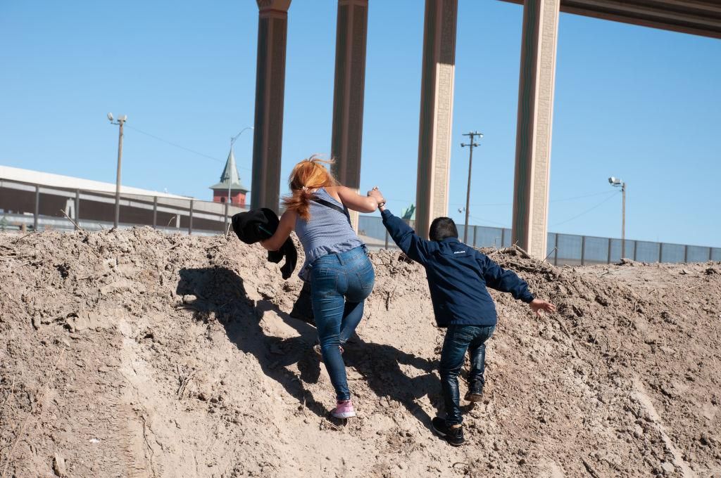A Central American woman and her son cross the Rio Grande on February 8th, 2021 to surrender to the border patrol at the Texas United States crossing. (Photo: David Peinado/Pacific Press/LightRocket via Getty Images)