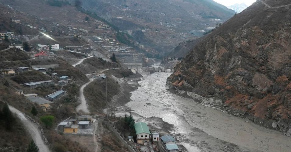A general view shows the remains of a dam (center) along a river in Tapovan of Chamoli district on February 8, 2021 destroyed after a flash flood thought to have been caused when a glacier burst on February 7