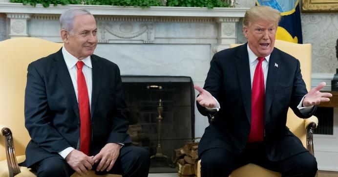 U.S. President Donald J. Trump (R) and Prime Minister of Israel Benjamin Netanyahu (L) deliver remarks to members of the news media during their meeting in the Oval Office of the White House March 25, 2019 in Washington, D.C.