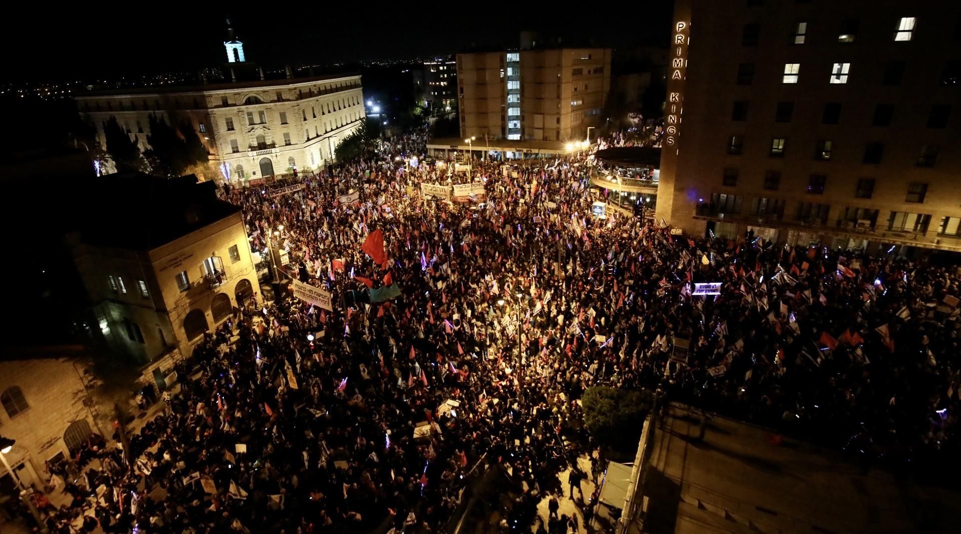 Tens of thousands of people gather in front of the Israeli Parliament during a pre-election demonstration to protest against Israeli Prime Minister Benjamin Netanyahu, in West Jerusalem on March 20, 2021. Demonstrators demanded Netanyahu resign over his indictments on charges of bribery, fraud and breach of public trust. 