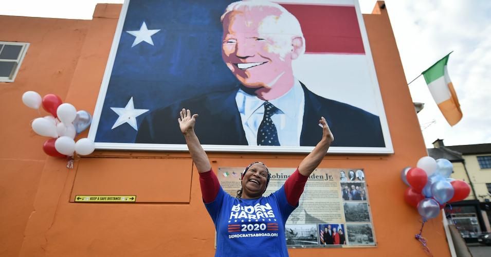 Beryl McCrainey Slevin from California and who voted using a mail in ballot stands in front of the mural of Joe Biden on November 7, 2020 as locals celebrate in anticipation of Biden being elected as the next US President in Ballina, Ireland. (Photo: Charles McQuillan/Getty Images)