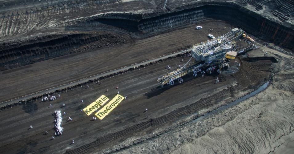 A photo from a "keep it in the ground" action at Vattenfall coalmine in Lusatia, Germany appears on the cover a new report on G20 governments financing fossil fuel projects. 