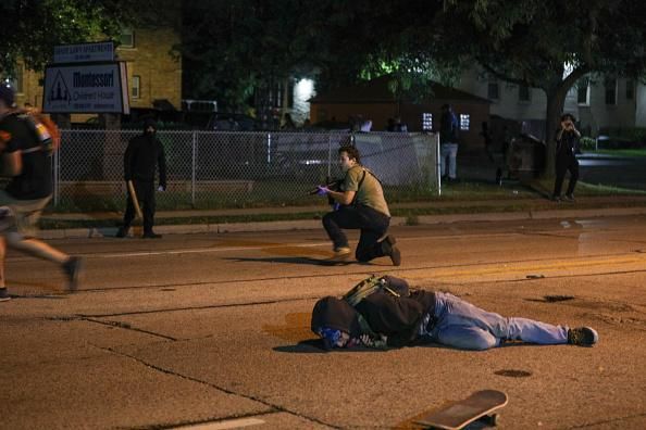 A man on the ground was shot during the third day of protests over the police shooting of Jacob Blake in Kenosha, Wisconsin on August 25, 2020. (Photo: Tayfun Coskun/Anadolu Agency via Getty Images)