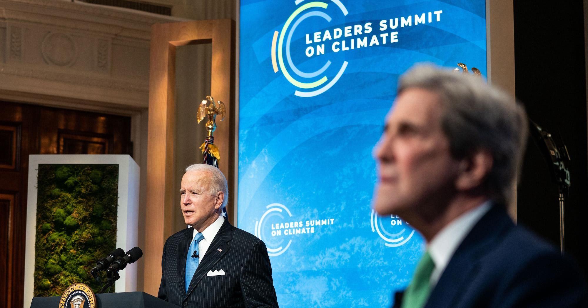 President Joe Biden delivers remarks as Special Presidential Envoy for Climate and former Secretary of State John Kerry listens during day 2 of the virtual Leaders Summit on Climate at the East Room of the White House April 23, 2021 in Washington, D.C. 