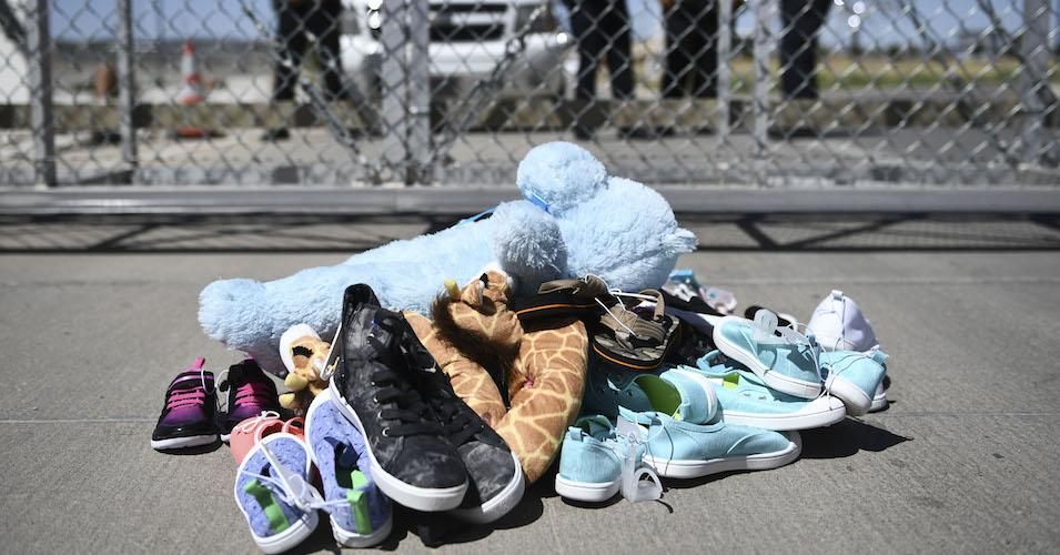 Shoes are left by people at the Tornillo Port of Entry near El Paso, Texas, June 21, 2018 during a protest rally by several American mayors against the US administration's family separation policy. 