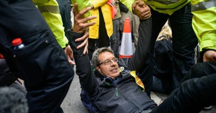 Writer George Monbiot is arrested by police officers after being arrested in Trafalgar Square on October 16, 2019 in London.