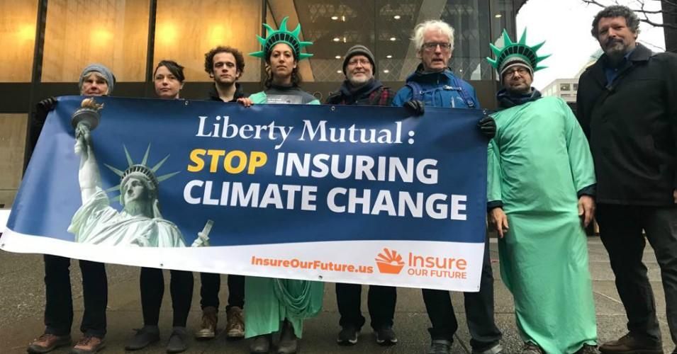 Activists with Insure Our Future gathered outside Liberty Mutual's Boston and Seattle offices in December 2019 to demand the insure company "take bold action in the face of the climate emergency and stop insuring fossil fuels." 