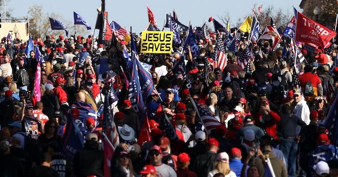 People participate in the "Million MAGA March" from Freedom Plaza to the Supreme Court, on November 14, 2020 in Washington, D.C.
