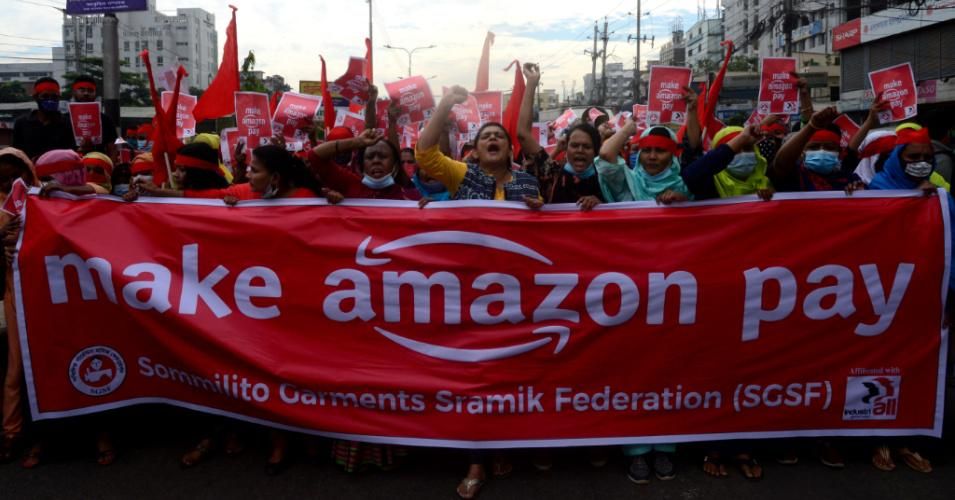 Activists of Sammilito Garments Sramik Federation (Combined Garments Workers Federation) march for fair wages and union rights for all Amazon supply chain workers in Dhaka, Bangladesh on November 27, 2020. (Photo: Mamunur Rashid/NurPhoto via Getty Images)