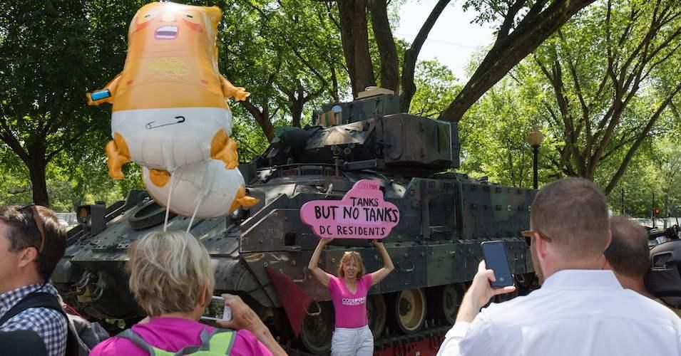 CodePink's Medea Benjamin poses in front a tank ahead of the "Salute to America" Fourth of July event with US President Donald Trump at the Lincoln Memorial on the National Mall in Washington, DC, on July 3, 2019. 