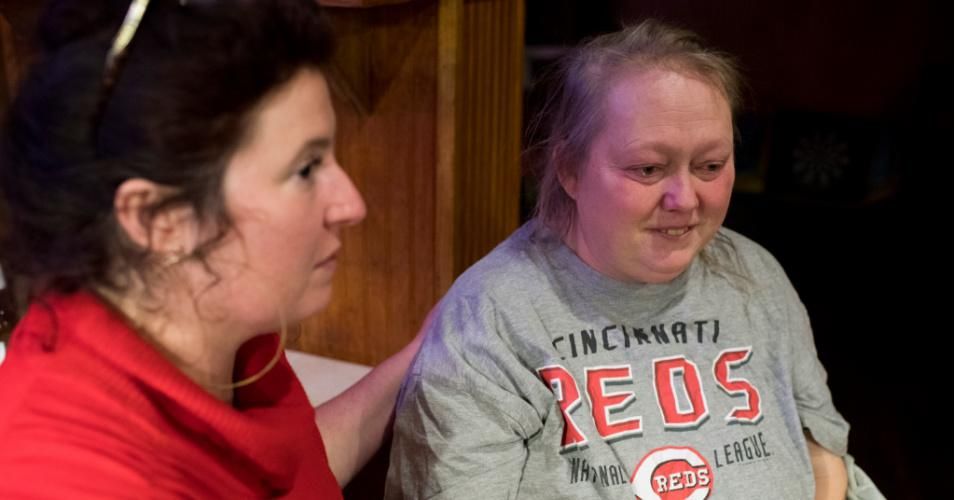 Cara Stewart, a legal advocate opposing Medicaid work requirements, comforts Pauline Creech in Covington, Kentucky on January 15, 2018. Creech is concerned that, between her disability and her frequent doctor's appointments for cancer treatments, she won't be able to meet the work requirement of 80 hours per month. (Photo: Carolyn Van Houten/The Washington Post via Getty Images)
