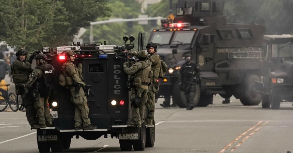 Police ride on an armored vehicle on May 31, 2020 in Bellevue, Washington. 