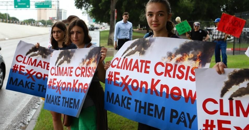 Climate activists protested outside ExxonMobil's annual meeting of shareholders in Irving, Texas.