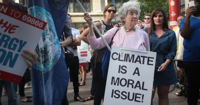 Demonstrators protest U.S. President Donald Trump's decision to exit the Paris climate change accord. 