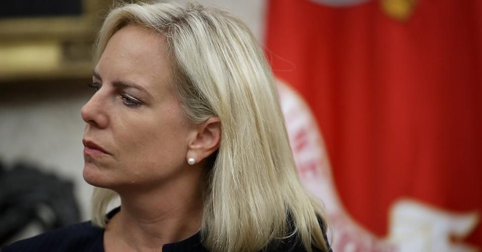 Homeland Security Secretary Kirstjen Nielsen listens as U.S. President Donald Trump speaks at the White House. 