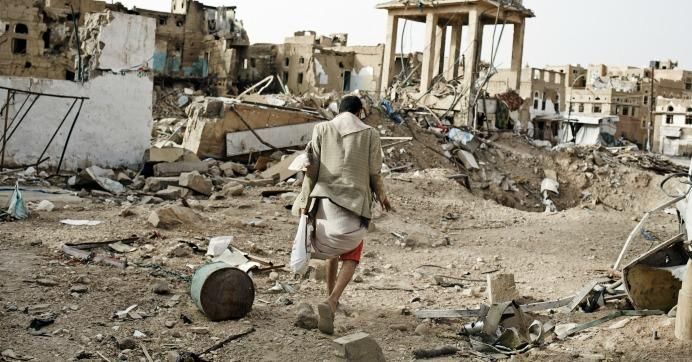 Civilians walk through the destroyed city of Sadah, Yemen, on June 15, 2015. (Photo: Sebastiano Tomada/Getty Images)
