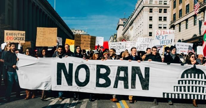 'no ban' protest sign