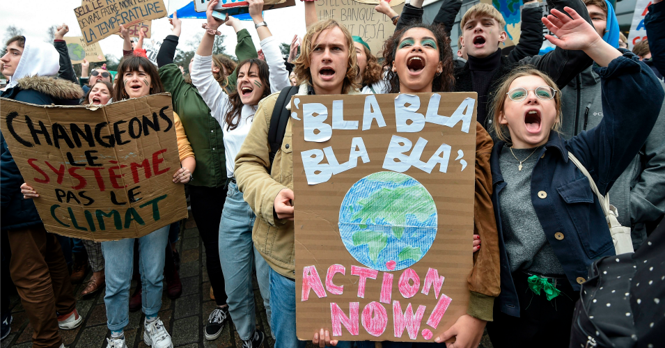 Demonstrators hold a placard reading 'action now!' during a demonstration against climate change on March 15, 2019 in Nantes, western France. (Photo: Sebastien Salom-Gomis/AFP via Getty Images)