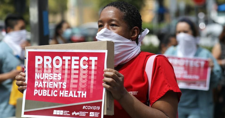 Nurses and supporters protest the lack of personal protective gear available at UCI Medical Center amid the coronavirus pandemic on April 3, 2020 in Orange, California.