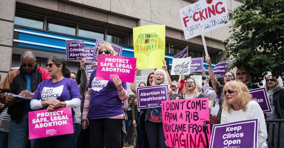 Activists are seen holding placards during the protest. Abortion rights activists took part in stop the bans rally nationwide after multiple states pass fetal heartbeat bills. (Photo: Megan Jelinger/SOPA Images/LightRocket via Getty Images)