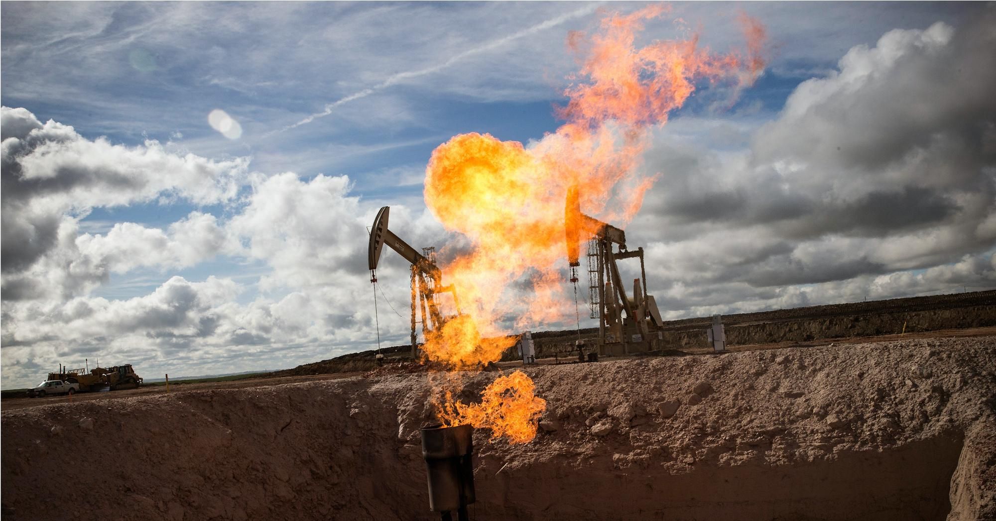 A gas flare is seen at an oil well site on July 26, 2013 outside Williston, North Dakota. Gas flares are created when excess flammable gases are released by pressure release valves during the drilling for oil and natural gas. (Photo: Andrew Burton/Getty Images) 