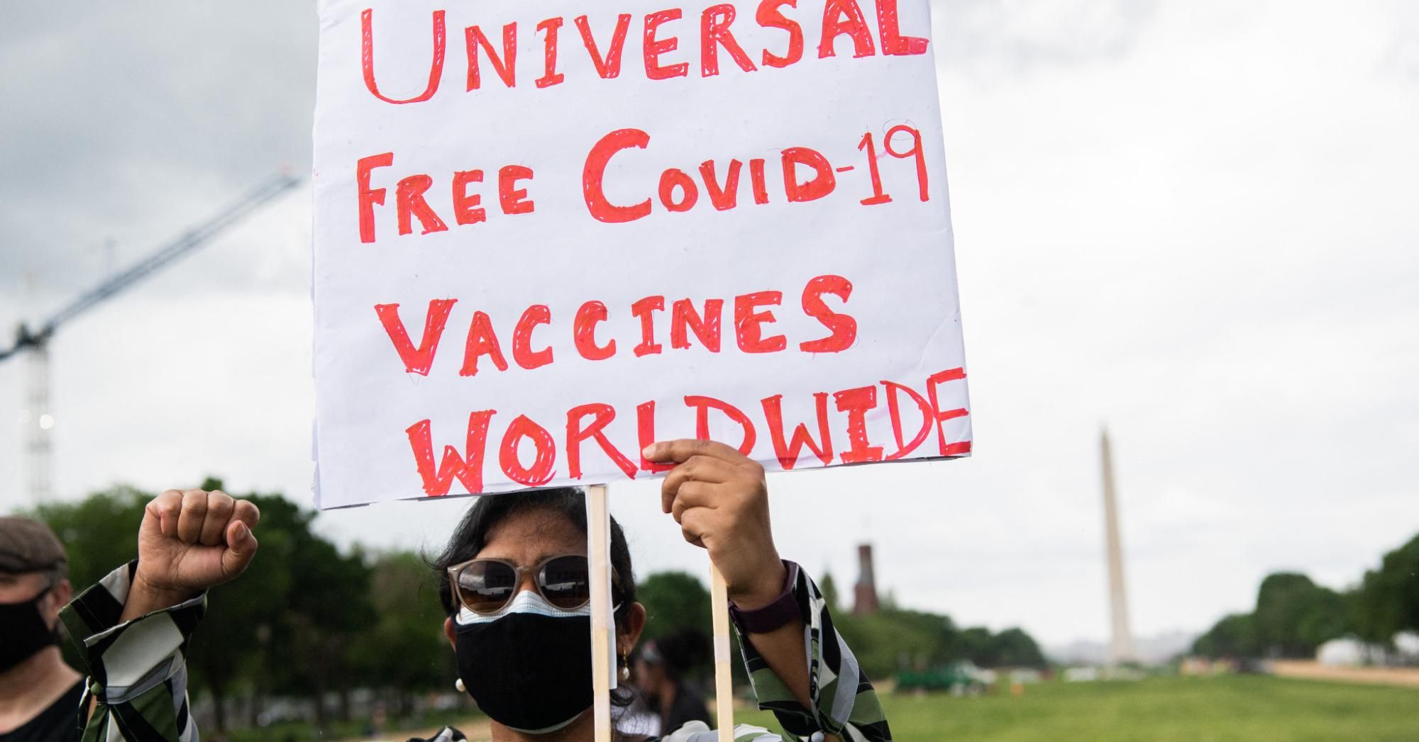 Demonstrators hold a rally in Washington, D.C. urging the U.S. to commit to a global coronavirus vaccination plan that includes sharing vaccine formulas with the world on May 5, 2021.