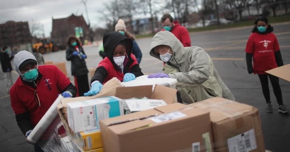 Staff and volunteers with Project C.U.R.E hold a drive outside the United Center to collect donations of Personal Protective Equipment (PPE) on March 29, 2020 in Chicago.