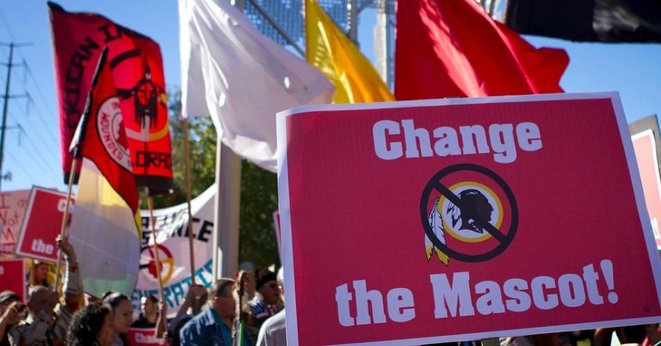 Protesters denounced what they called the "racist and offensive" team name outside of a Washington Redskins game in Denver. (Photo: Confrontation Media/ cc/ Flickr)