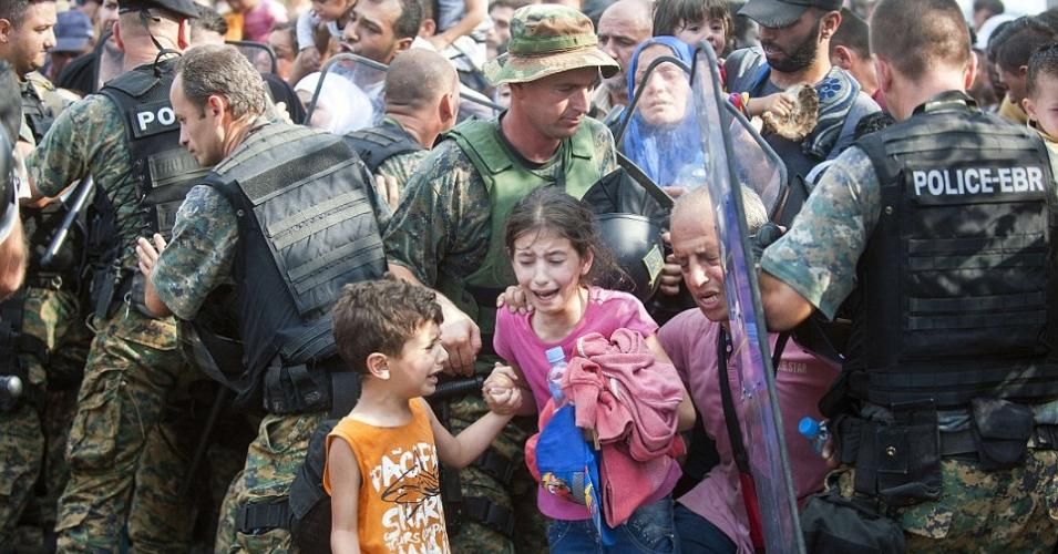 Refugee children are frightened by riot police at the Greece-Macedonian border in 2015, before Macedonia shut its border to asylum seekers earlier this year. (Photo: AFP/Getty Images)