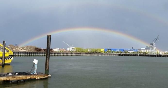 Rainbow over waterway in Brooklyn, New York