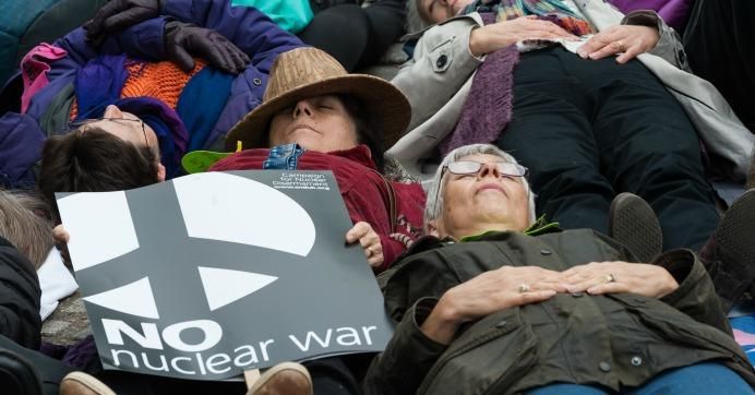 Anti-nuclear weapons activists from Campaign for Nuclear Disarmament stage a die-in protest outside Westminster Abbey on May 3, 2019 in London. 