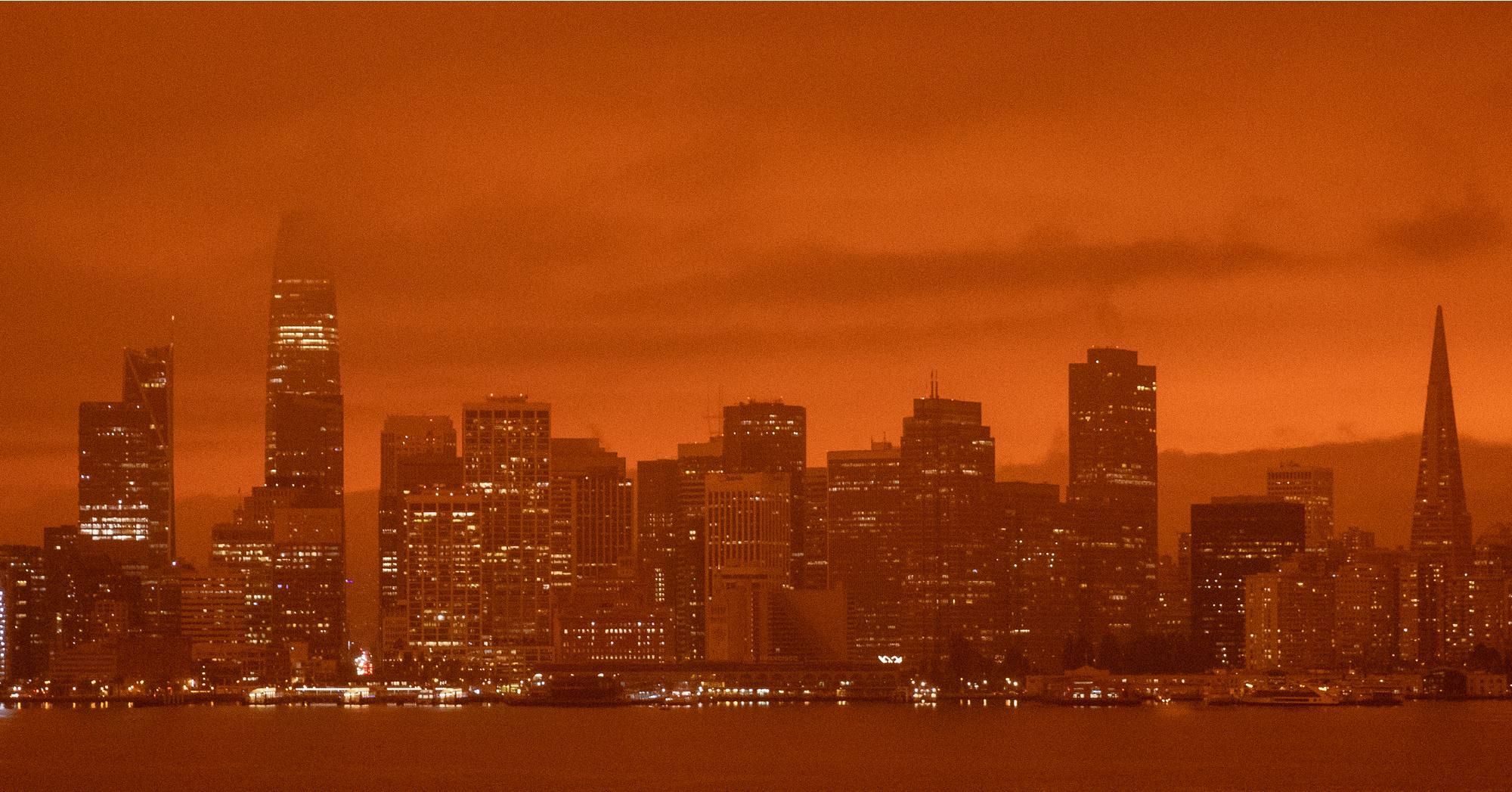 The sky over San Francisco and much of northern California turned orange on September 9, 2020 due to numerous climate-driven wildfires burning in the region. (Photo: Jessica Christian/The San Francisco Chronicle via Getty Images) 