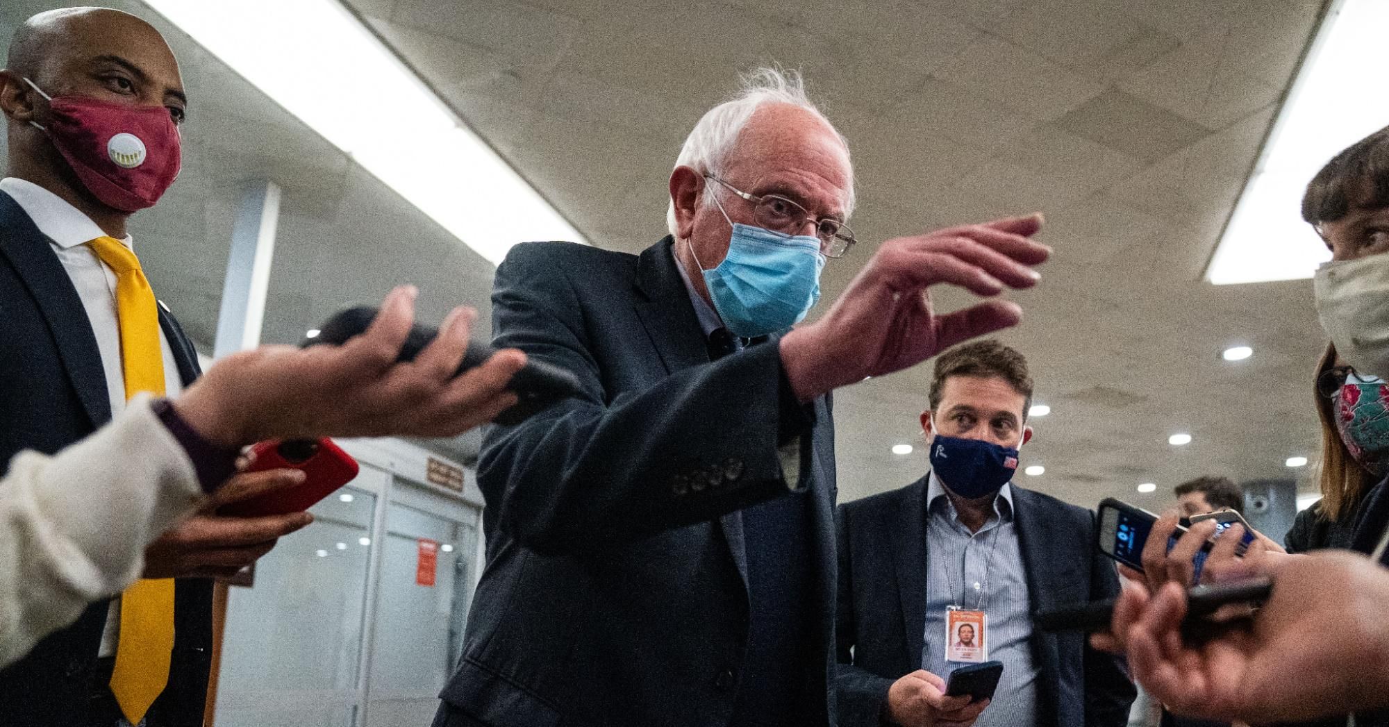 Sen. Bernie Sanders (I-Vt.) speaks with reporters in the Senate Subway on Tuesday, April 13, 2021 in Washington, D.C.