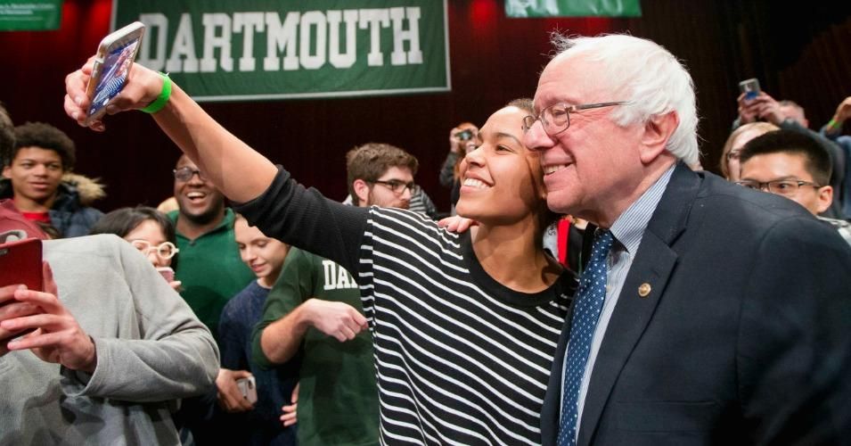 Sen. Bernie Sanders has a selfie taken with a young audience member after speaking at Dartmouth College on January 14, 2016. (Photo: John Minchillo/AP)