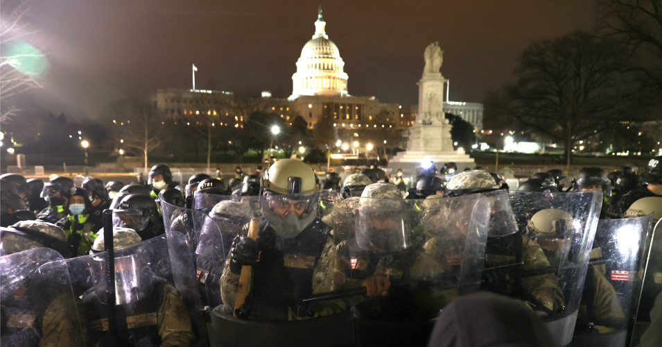 Members of the National Guard assist police officers in dispersing protesters who are gathering at the U.S. Capitol Building on January 06, 2021 in Washington, DC. Pro-Trump protesters entered the U.S. Capitol building after mass demonstrations in the nation's capital during a joint session Congress to ratify President-elect Joe Biden's 306-232 Electoral College win over President Donald Trump. (Photo by Tasos Katopodis/Getty Images)